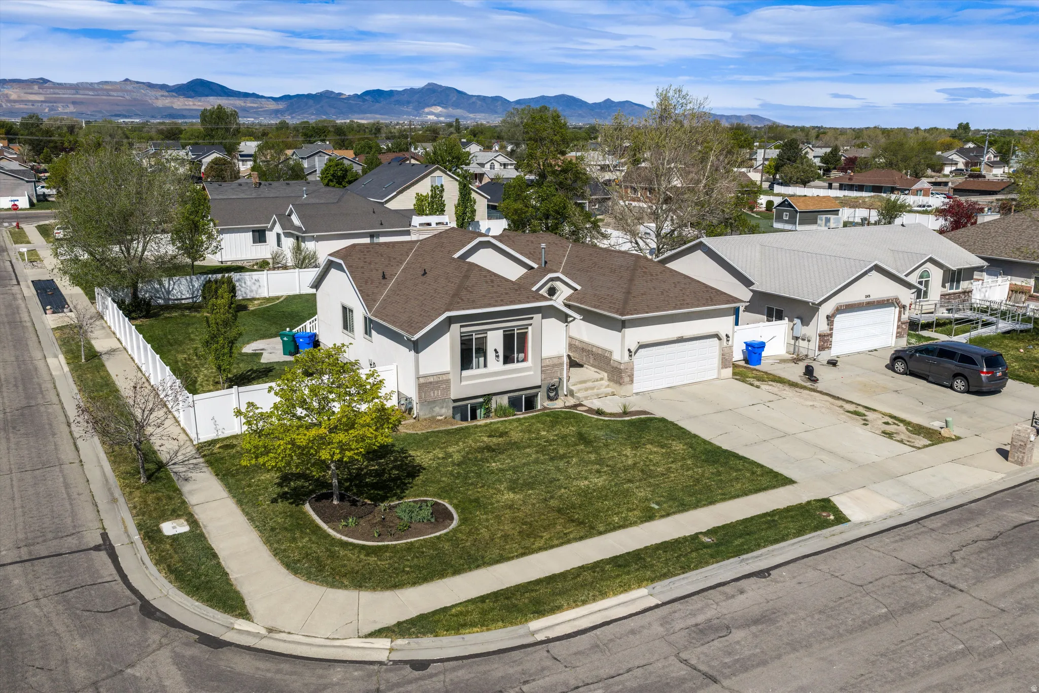 Aerial perspective of suburban area featuring a mountainous background
