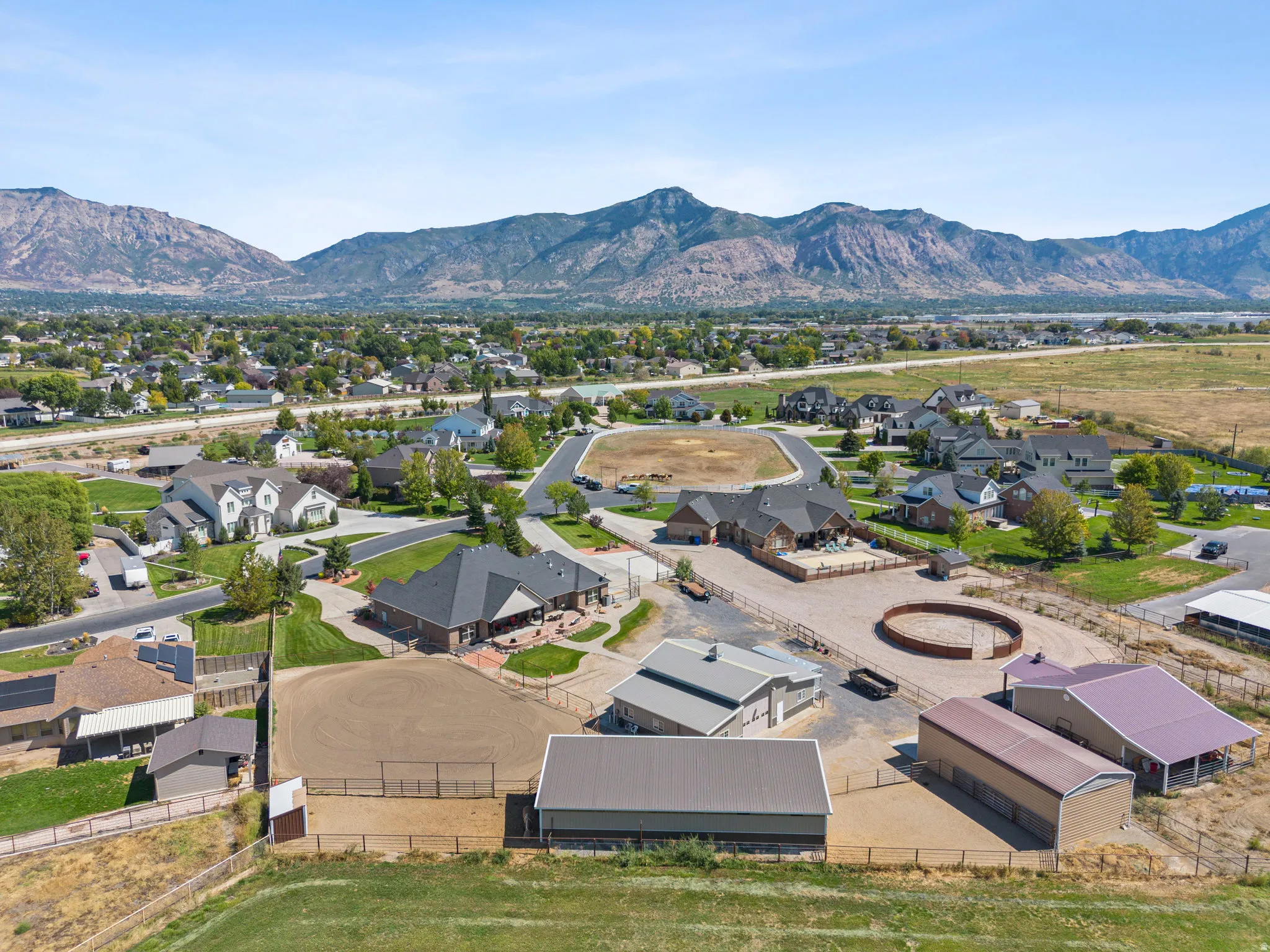 Aerial perspective of suburban area with a mountainous background