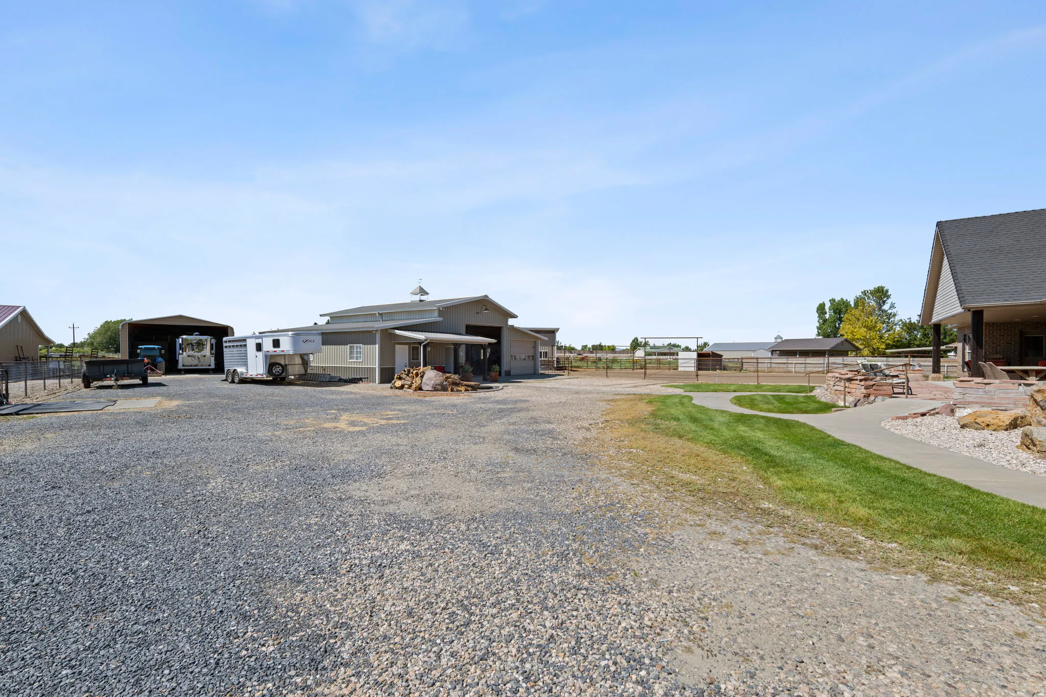 View of dirt / gravel road featuring a gated entry