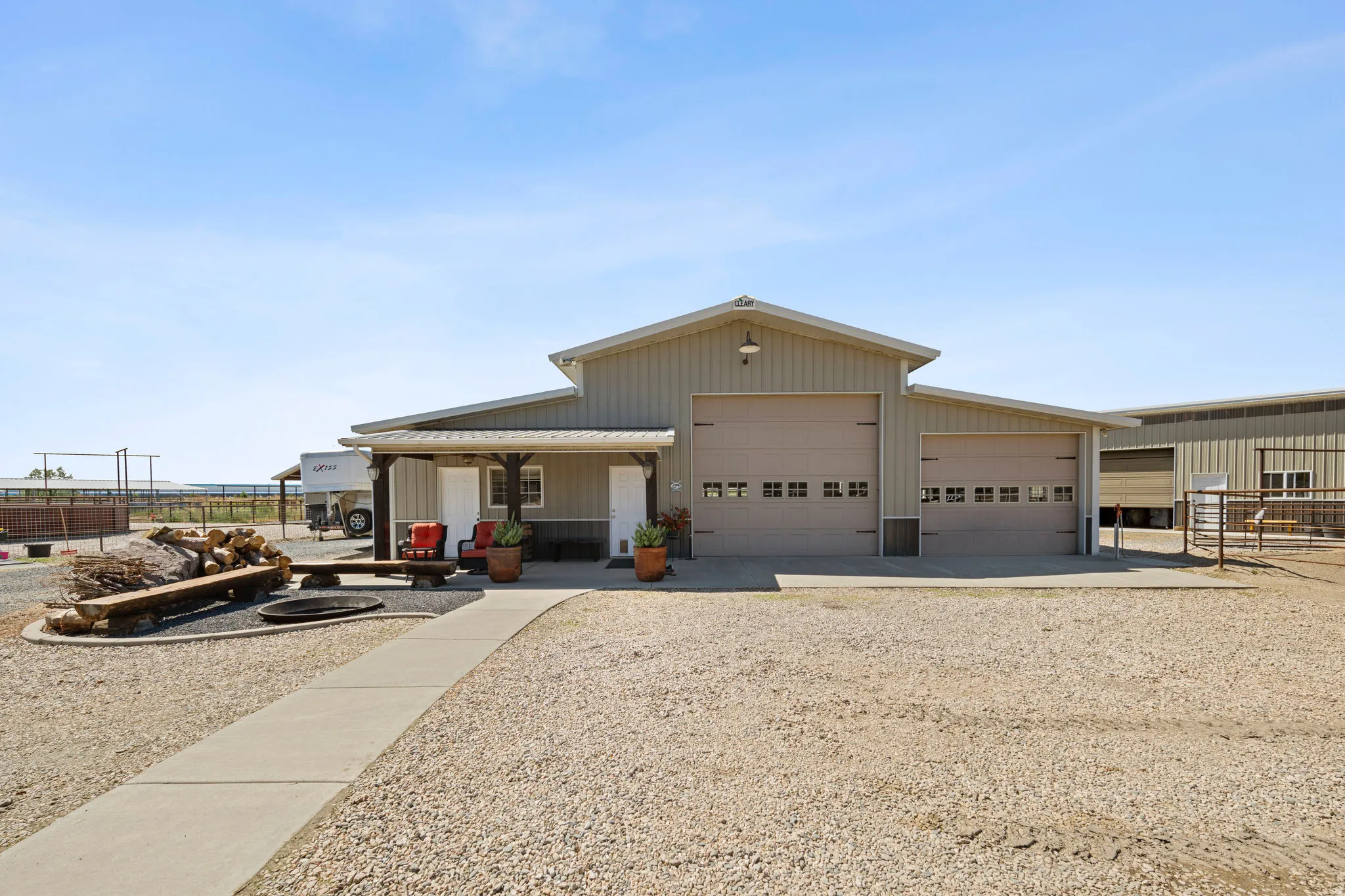 View of front of property with driveway and covered porch