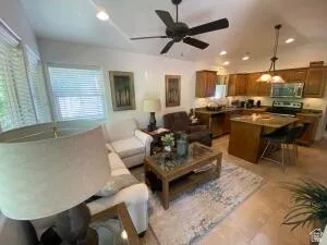 Living room featuring a ceiling fan and recessed lighting