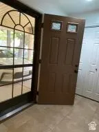 Entryway featuring light tile patterned floors
