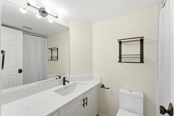 Clean finishes and updated fixtures create a polished, easy-to-maintain bathroom space.