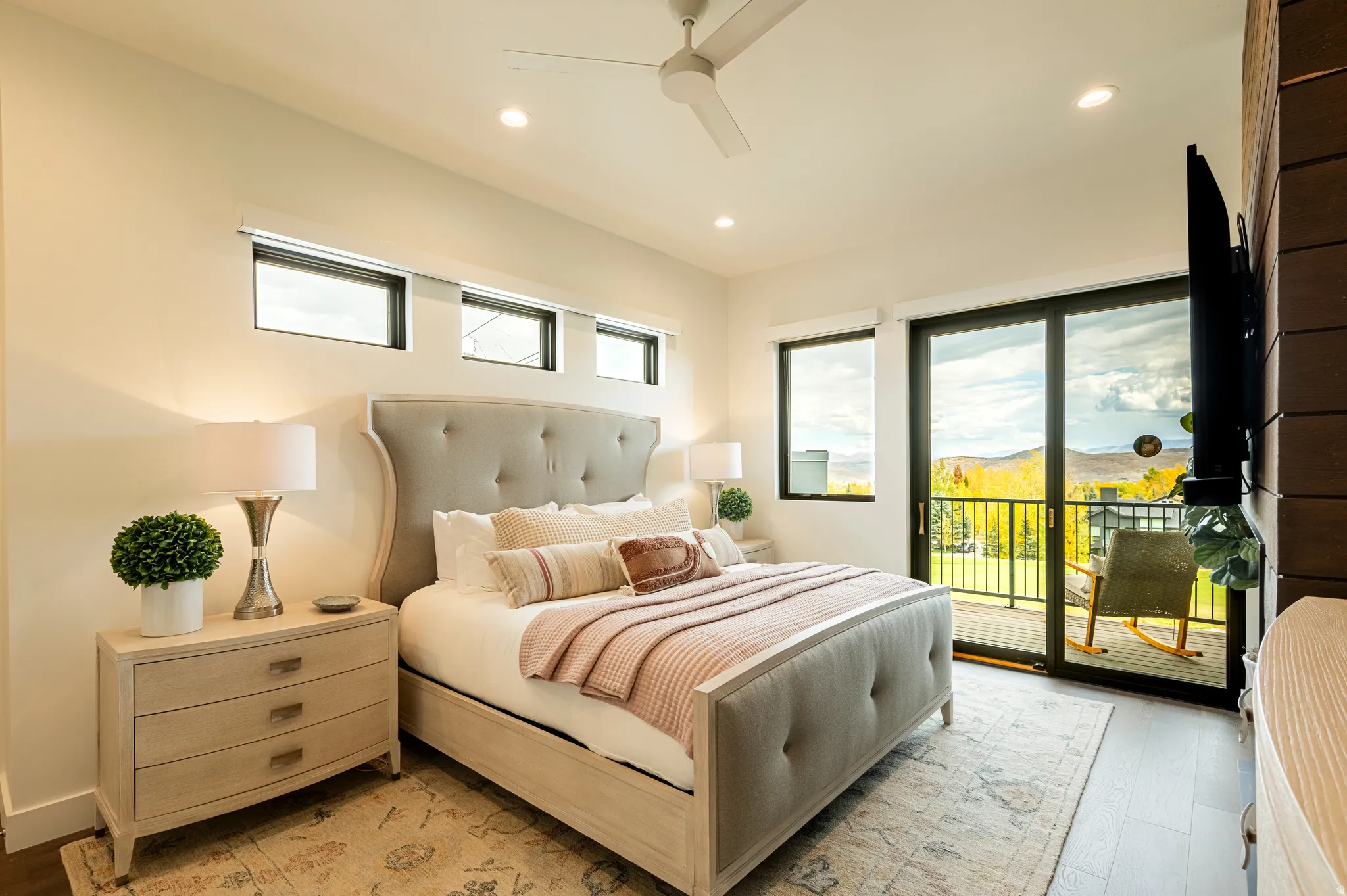 Bedroom featuring light wood-style flooring, access to exterior, a ceiling fan, and recessed lighting