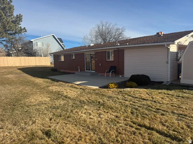 Back of property with a patio