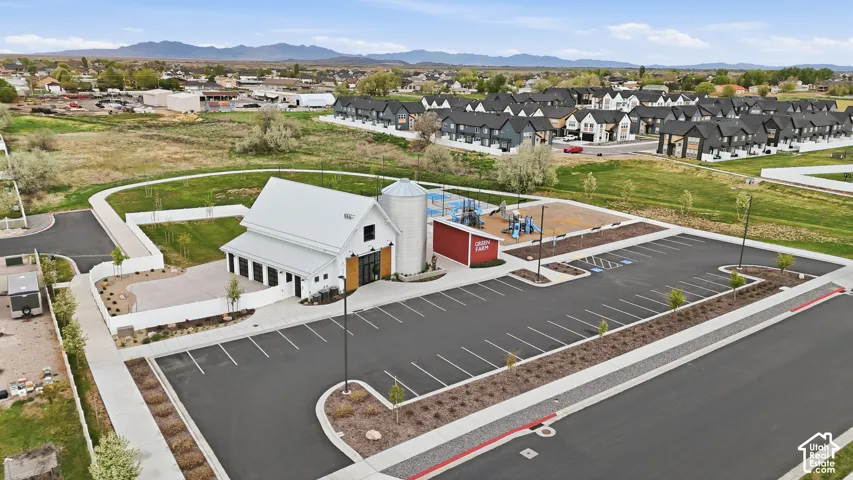Aerial perspective of suburban area with a mountain backdrop
