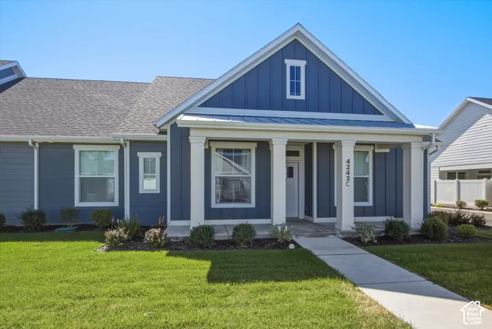 Blue horizontal siding with white trim