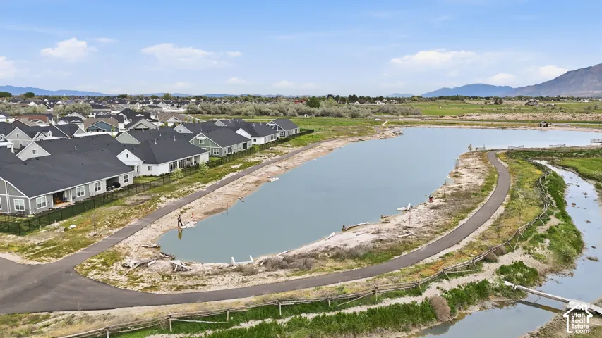 Aerial view of residential area featuring a water and mountain view