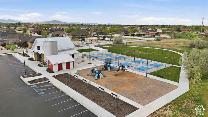 Aerial perspective of suburban area with a mountain backdrop