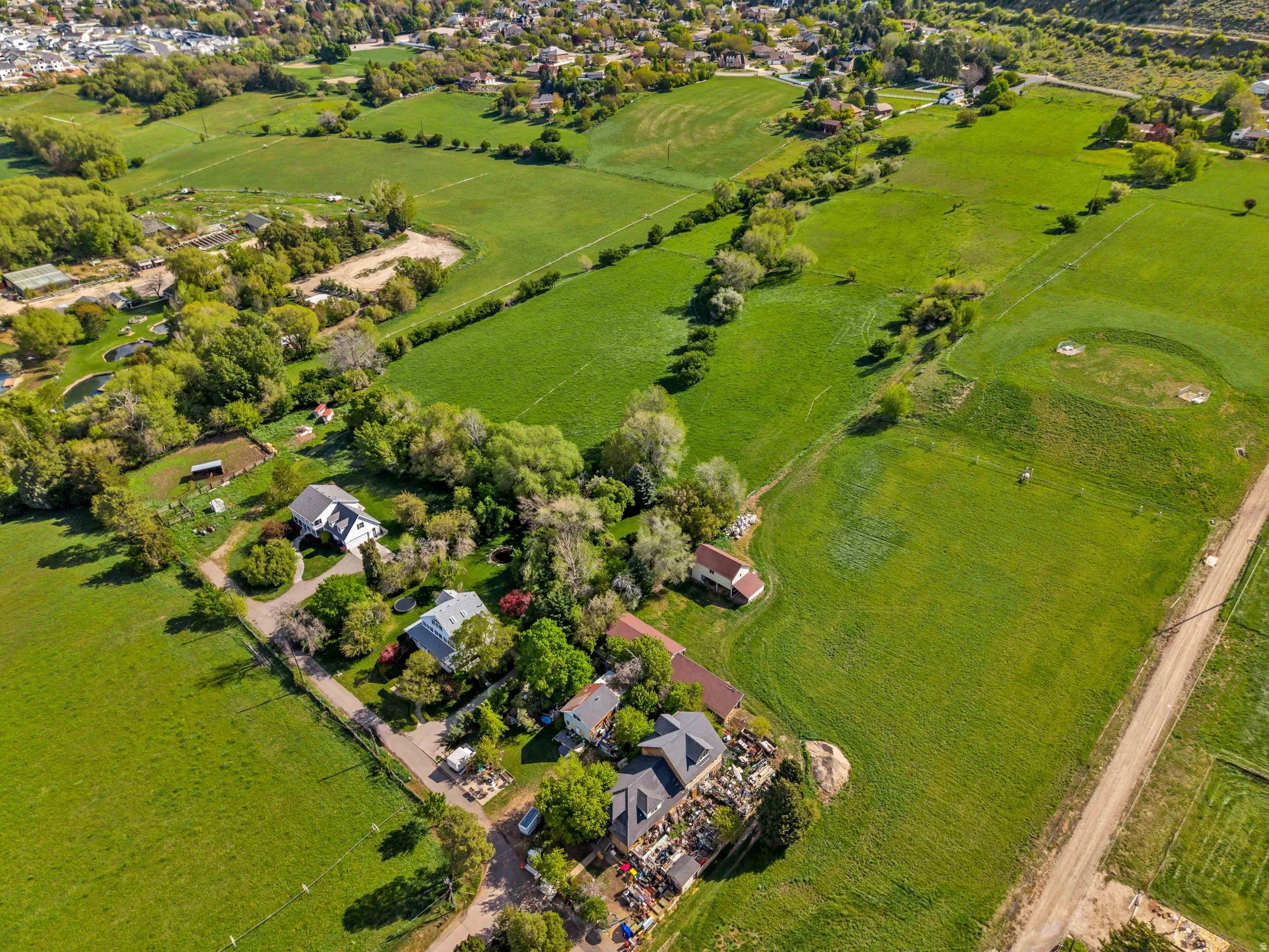 Aerial view of property and surrounding area featuring rural landscape
