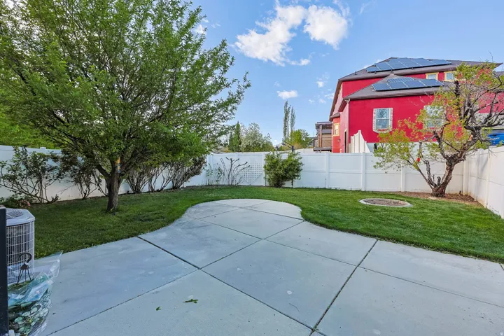 Fenced backyard featuring a patio