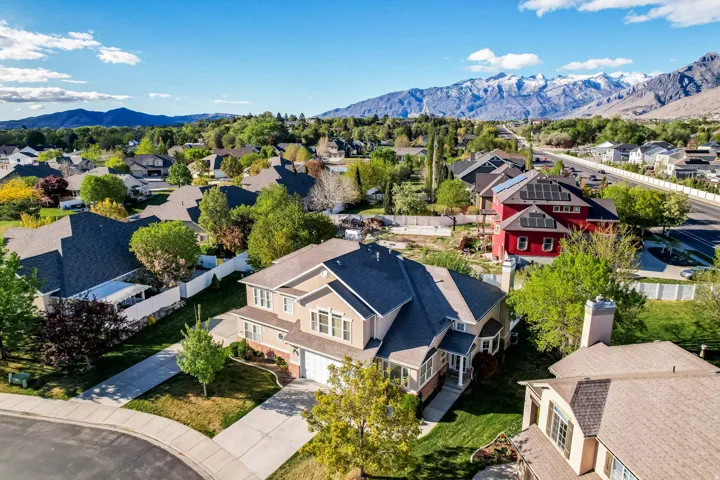 Aerial view of residential area featuring a mountain backdrop