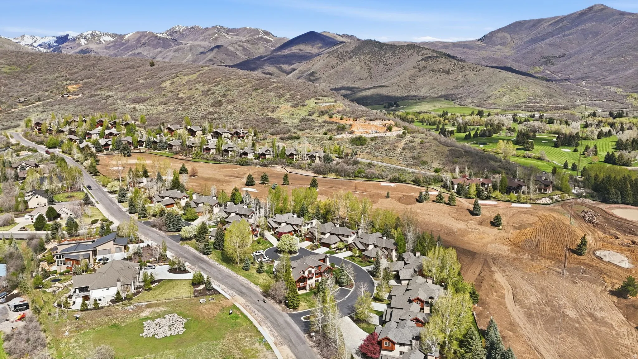 Aerial perspective of suburban area with a mountain backdrop