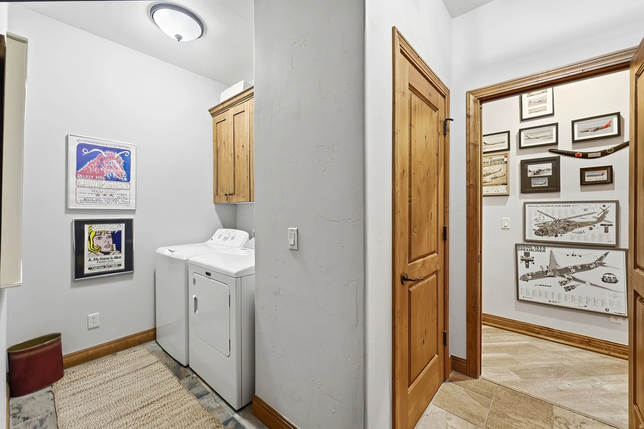 Laundry area with cabinet space and washer and dryer
