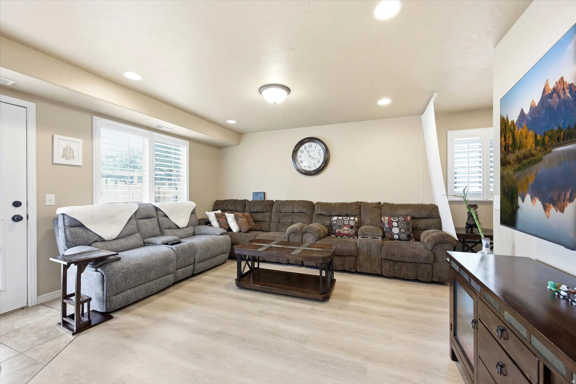 Living area featuring recessed lighting and light wood finished floors