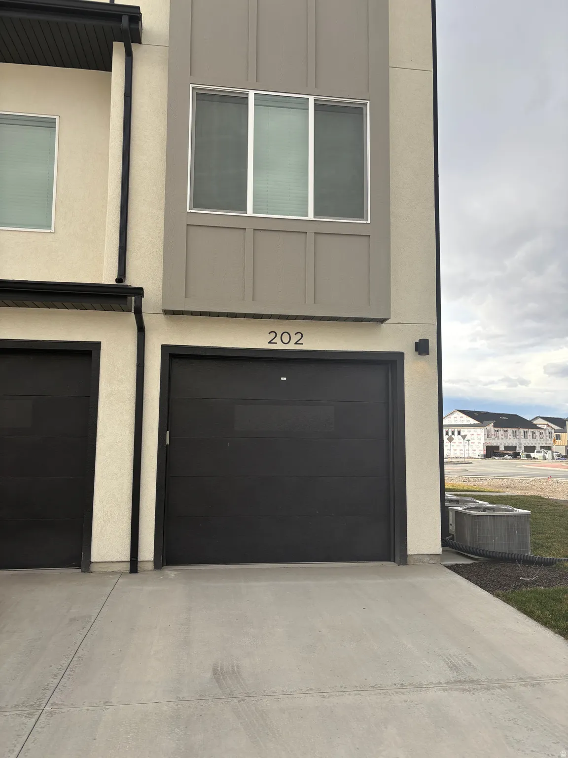 Garage featuring concrete driveway