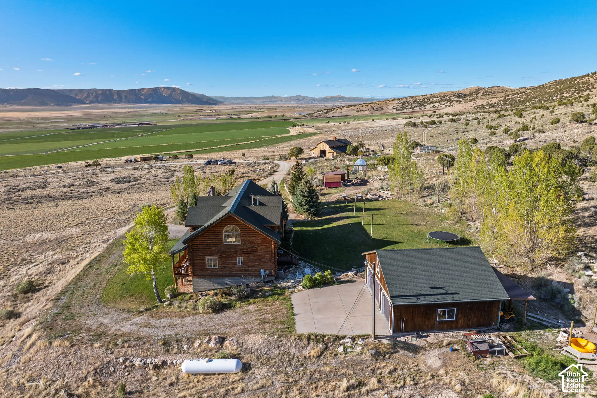 Overview of rural landscape featuring a mountain backdrop