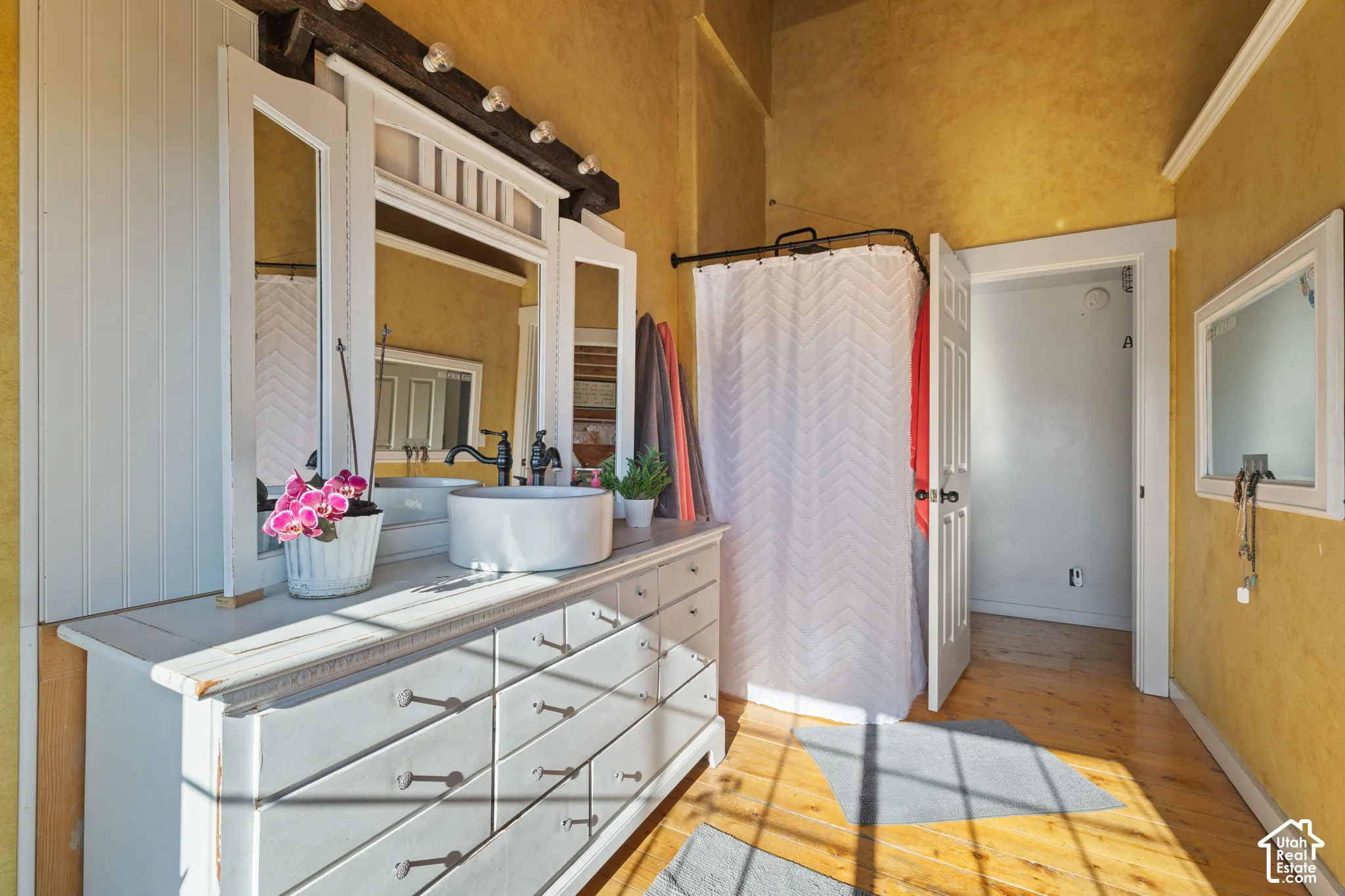 Primary ensuite with large, jetted tup with stunning valley views. Custom vanity and separate shower