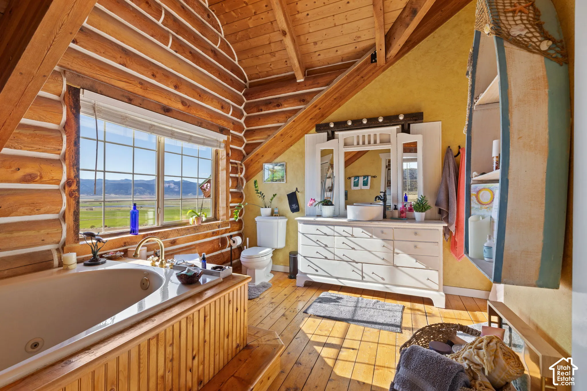 Primary ensuite with large, jetted tup with stunning valley views. Custom vanity and separate shower