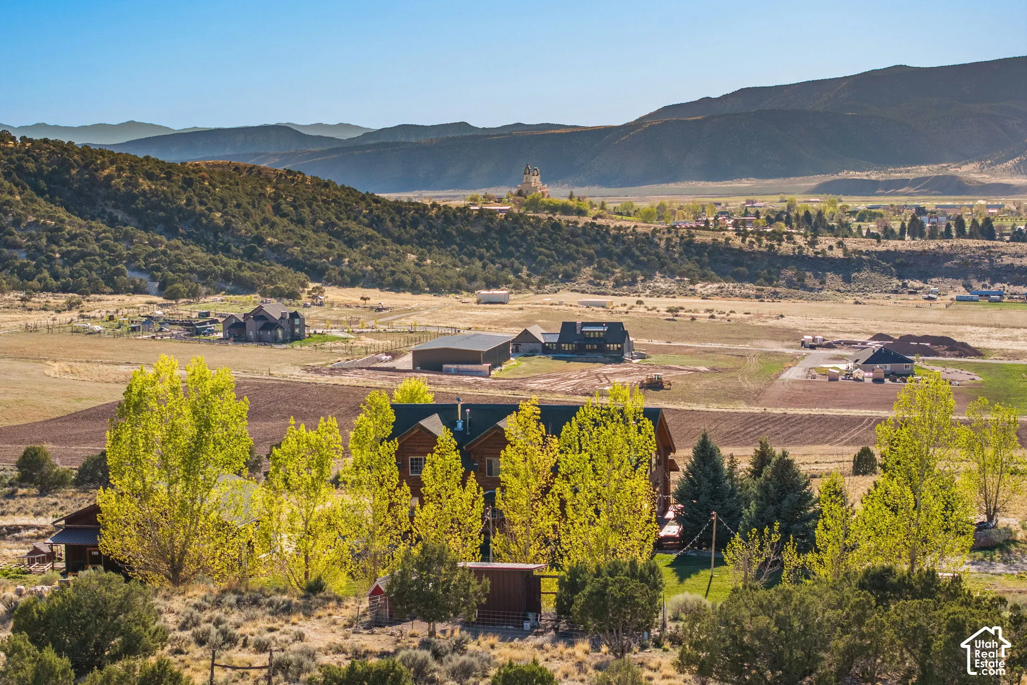 View of mountain backdrop featuring rural landscape