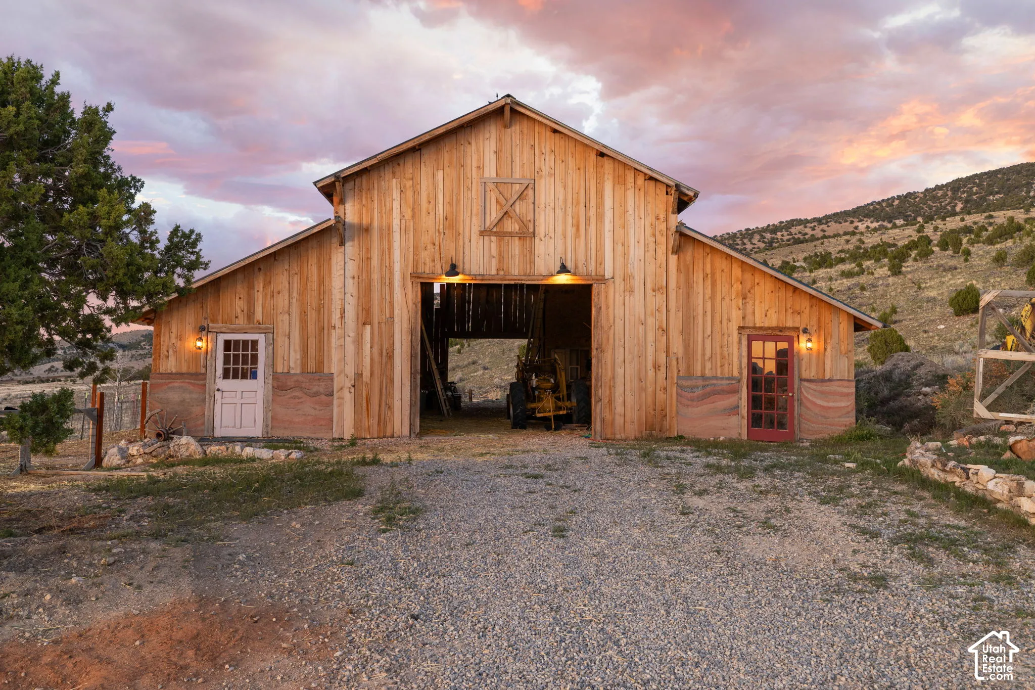 Outdoor structure at dusk featuring a barn