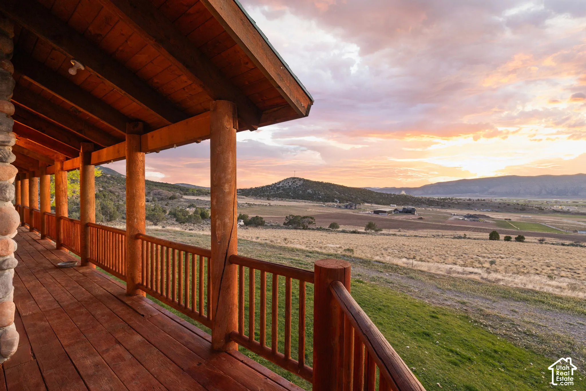 Wooden deck with a mountain, valley and temple views