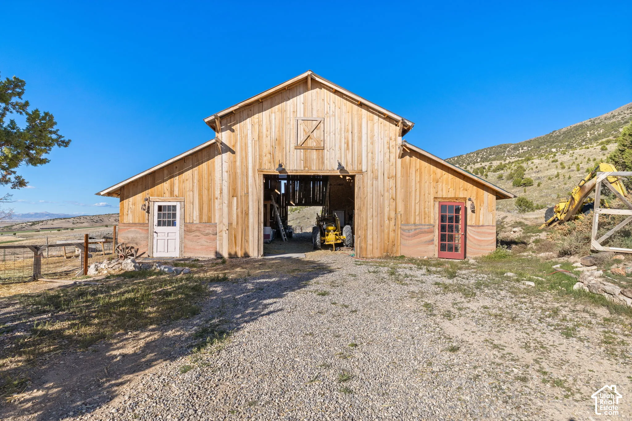 View of barn with a mountain view