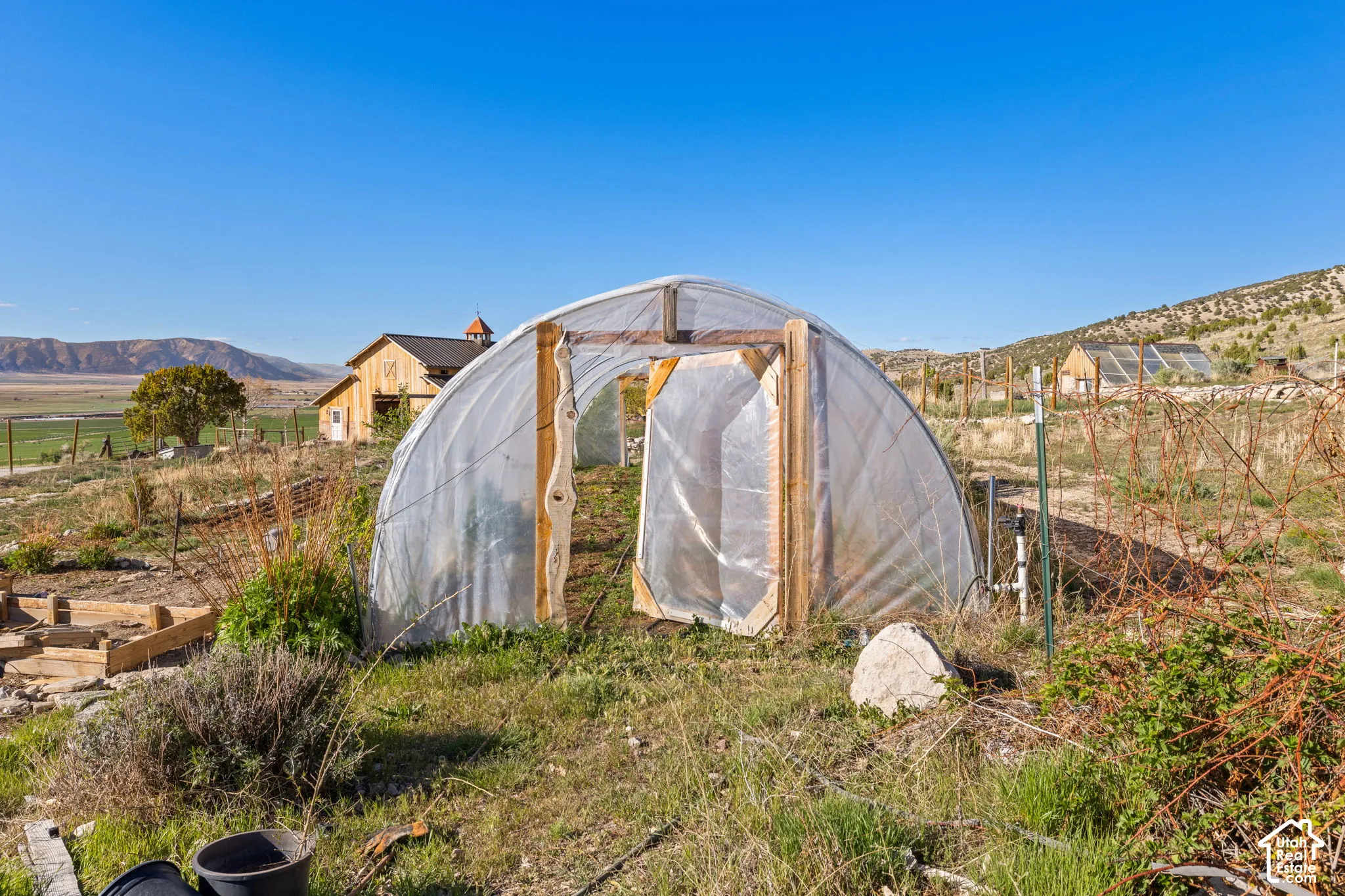 View of greenhouse with a mountain view and a view of rural / pastoral area