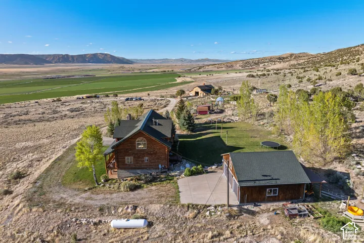 Overview of rural landscape featuring a mountain backdrop
