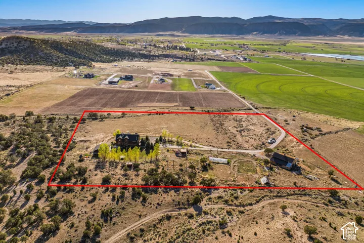 View of rural area featuring property parcel outlined and a mountainous background