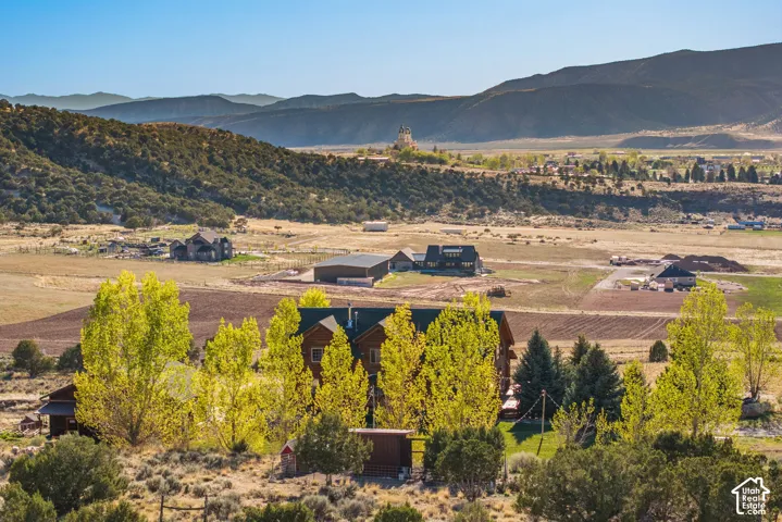 View of mountain backdrop featuring rural landscape