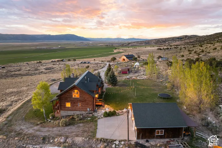 Aerial view at dusk of a view of rural / pastoral area and a mountain view