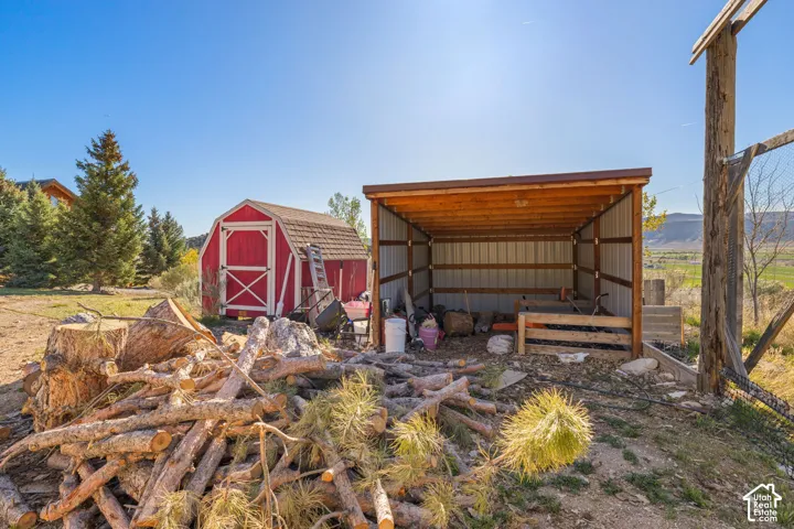 Wood shed and gambrel shed/utility barn