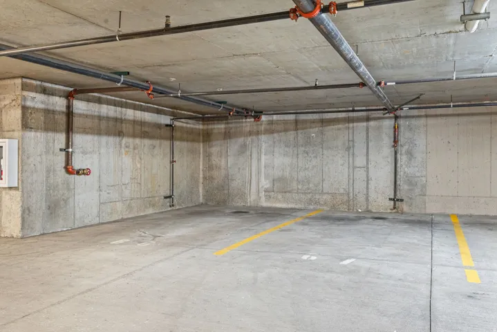 Garage featuring a parking garage