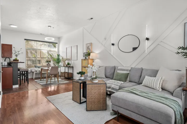 Living area with wood finished floors and a textured ceiling