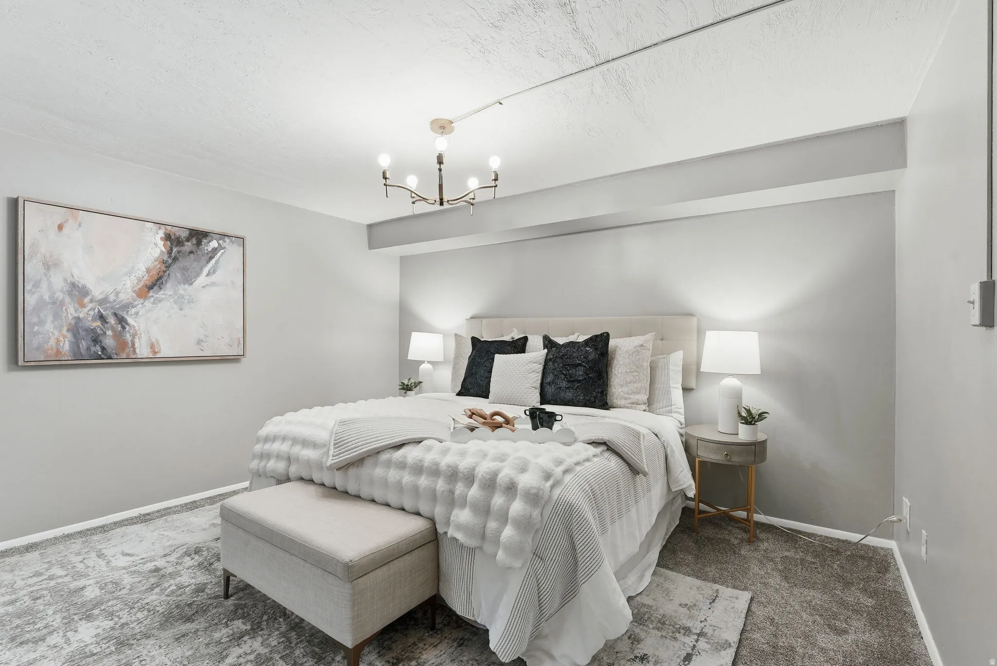 Bedroom with carpet and suspended lighting