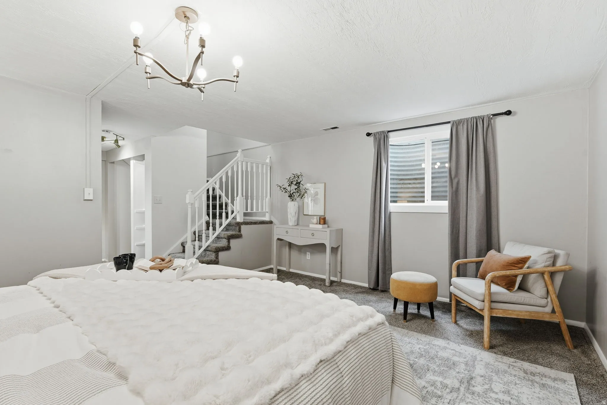 Bedroom featuring carpet floors and suspended lighting