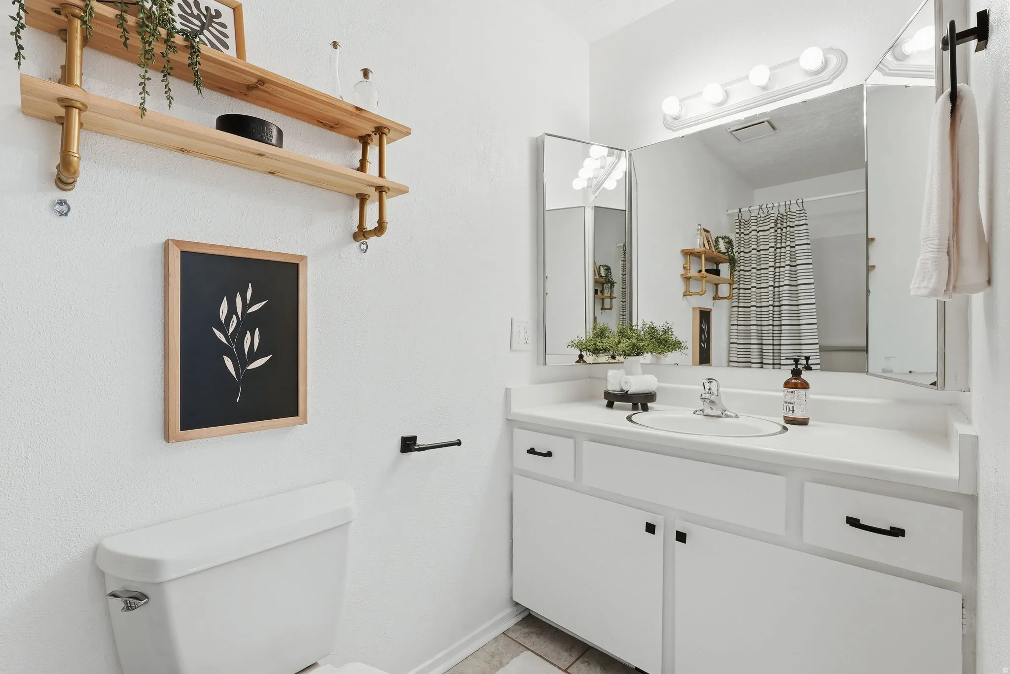 Bathroom featuring vanity and a shower with curtain