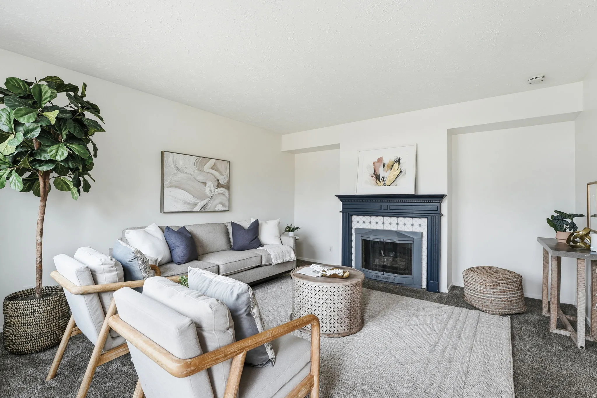 Living area featuring carpet floors and a fireplace