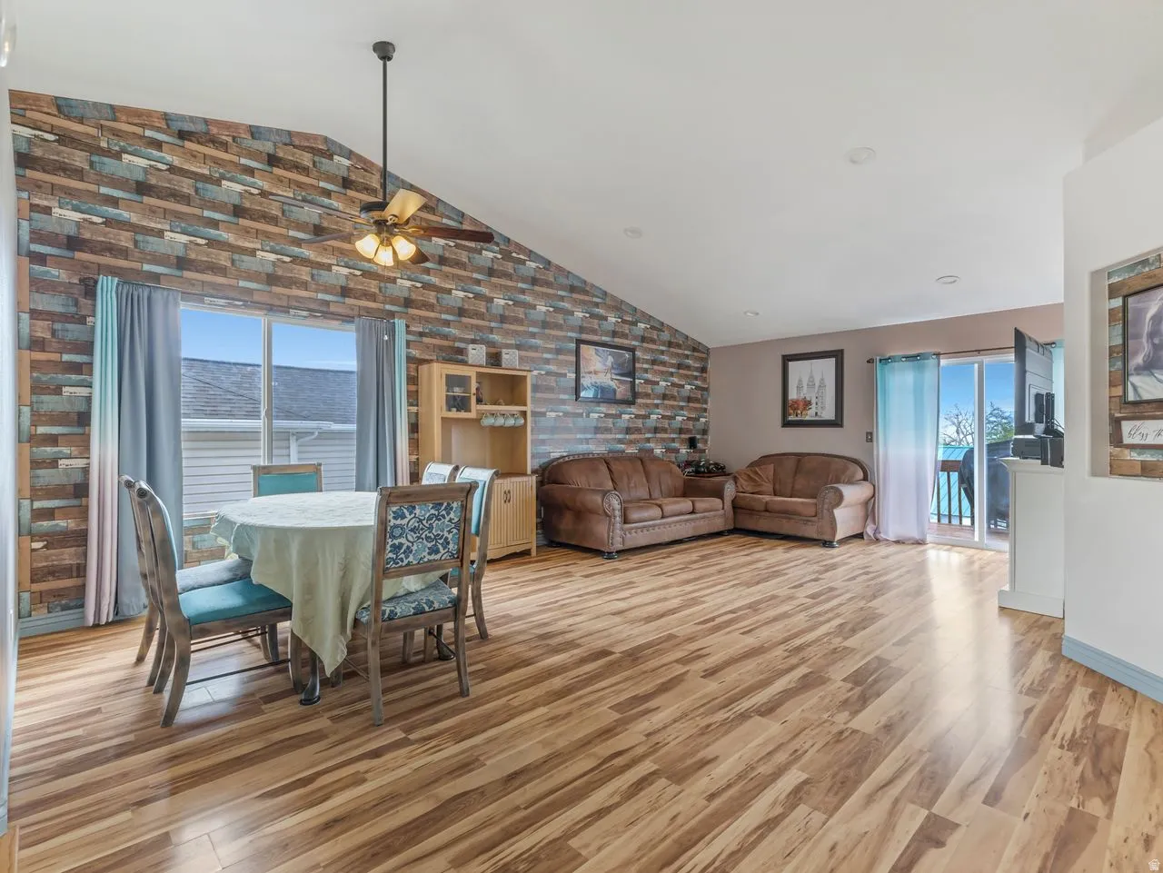Dining room featuring light wood finished floors and ceiling fan