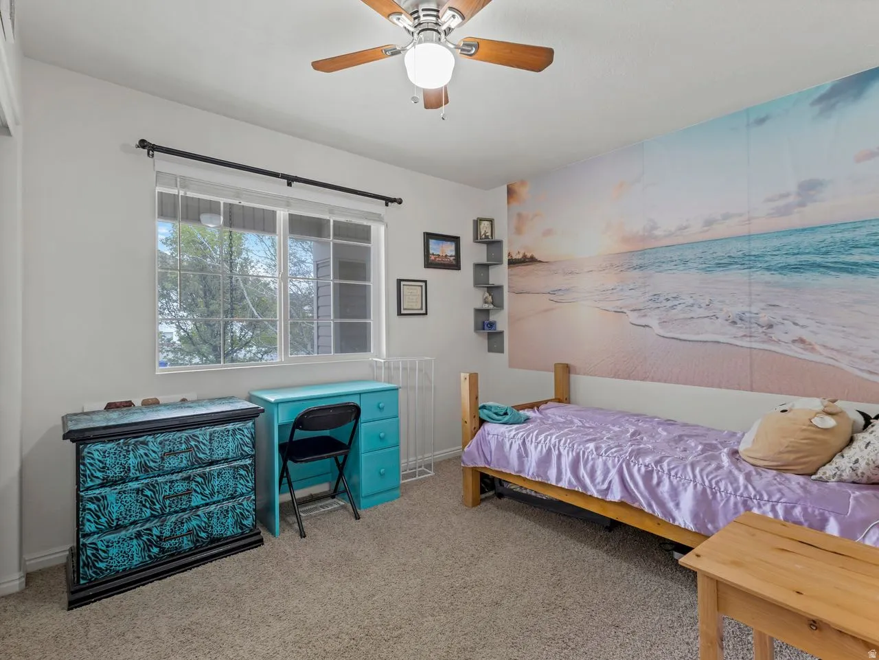 Bedroom featuring light carpet and ceiling fan
