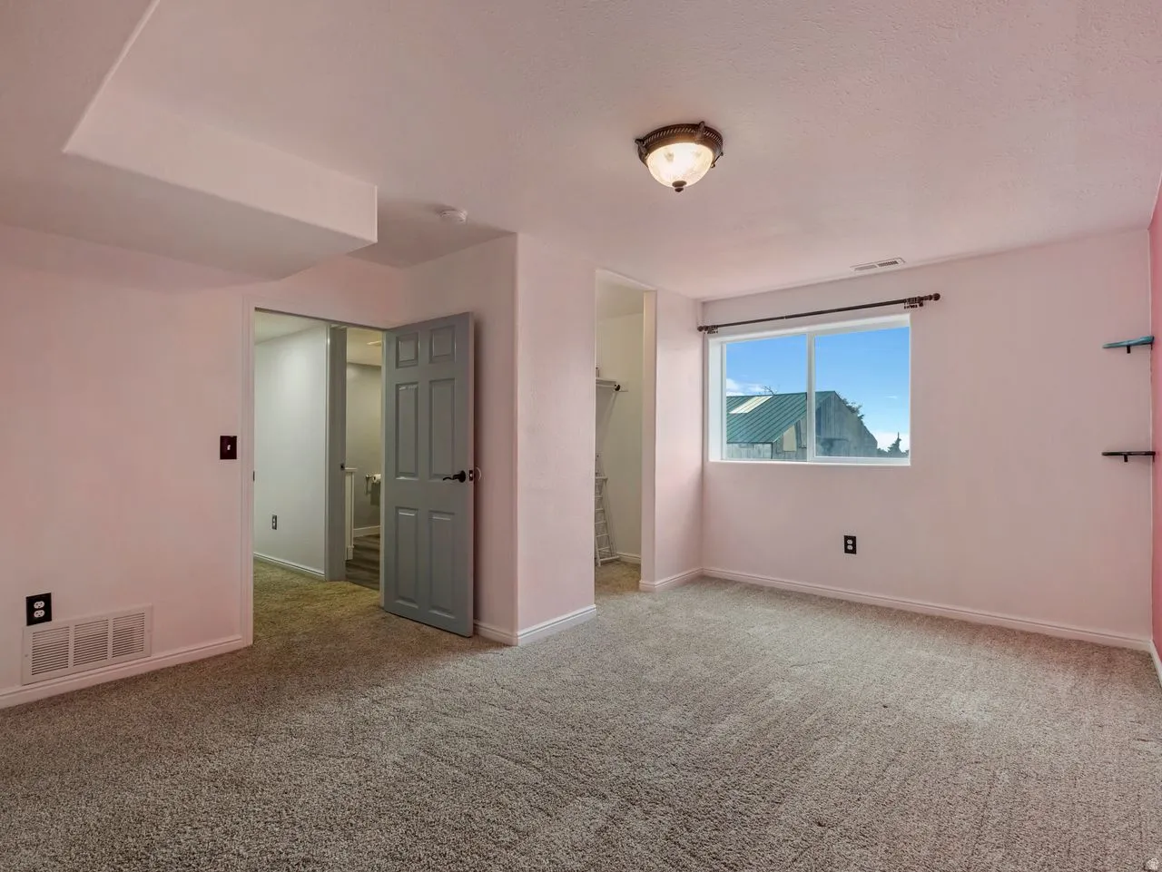 Empty room with baseboards and carpet floors