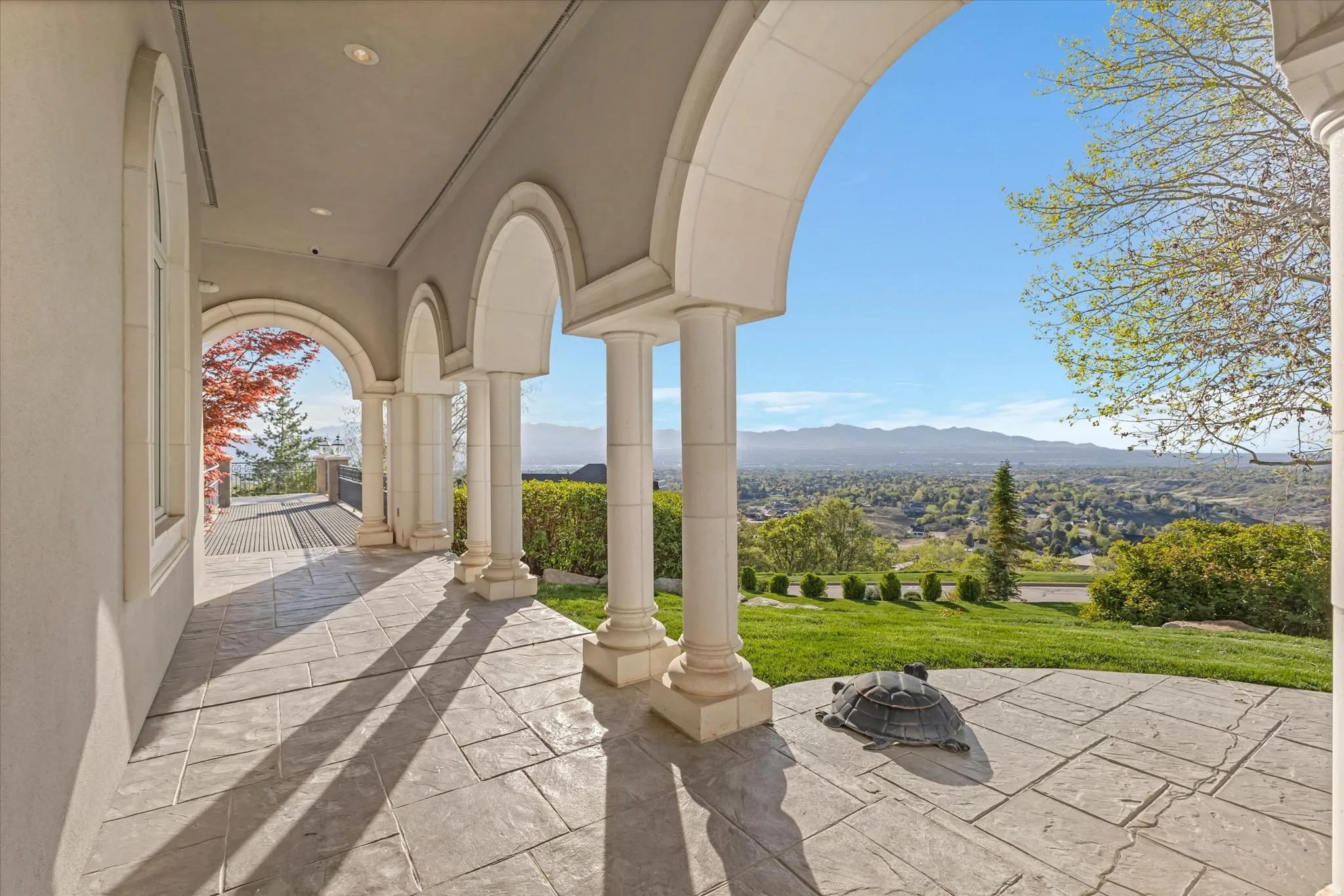 View of patio / terrace featuring an outdoor fire pit and a mountain view