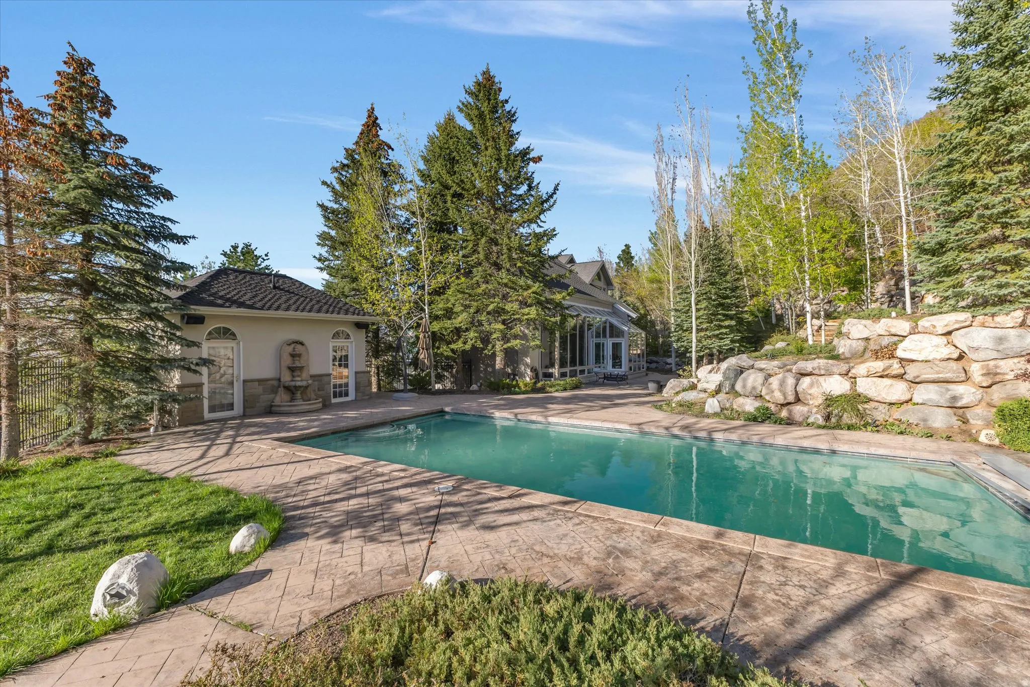 Outdoor pool featuring a patio