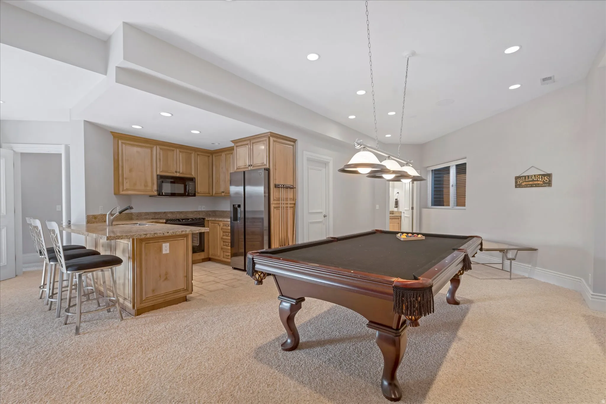 Rec room featuring light colored carpet, recessed lighting, and billiards
