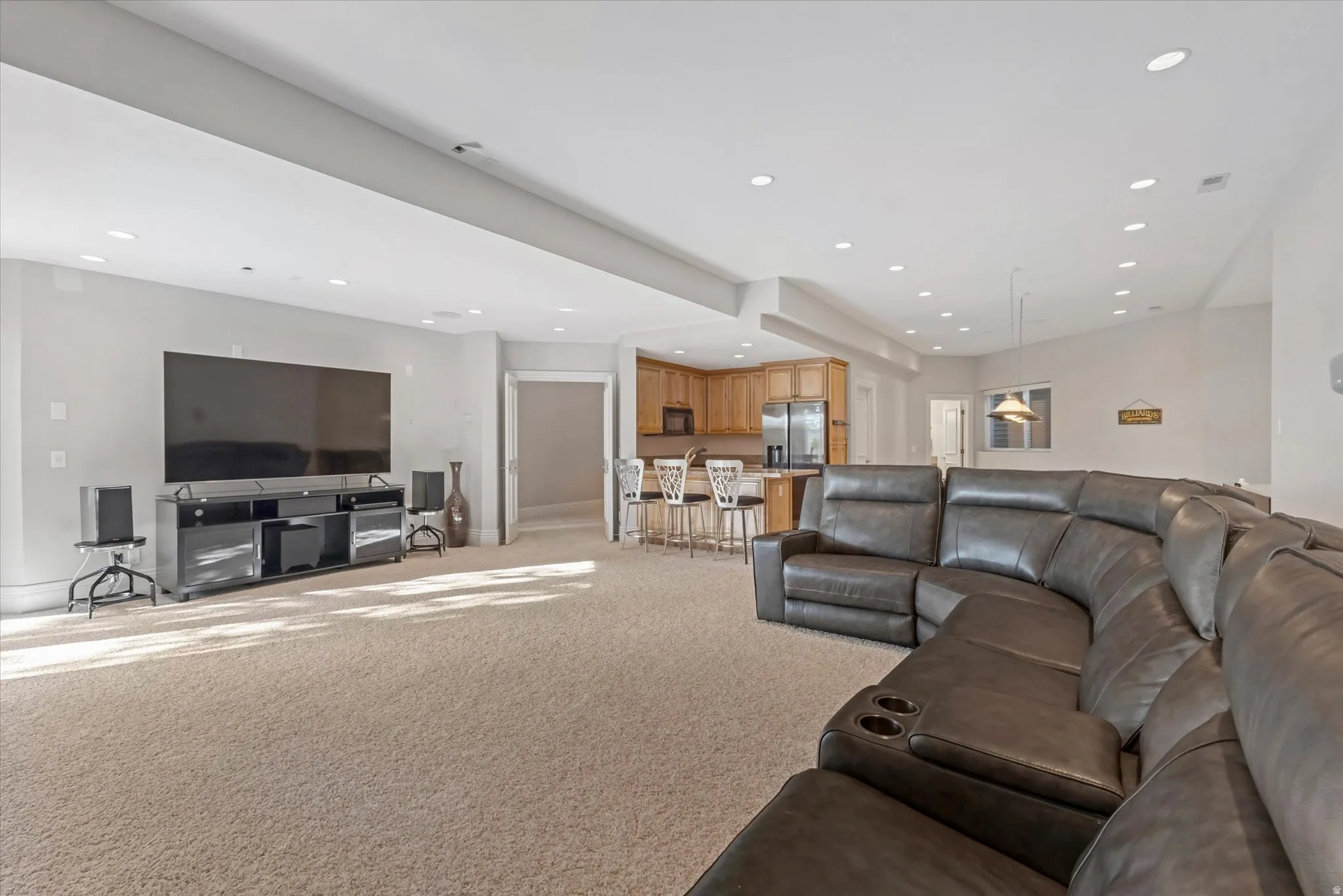 Living room featuring light carpet and recessed lighting
