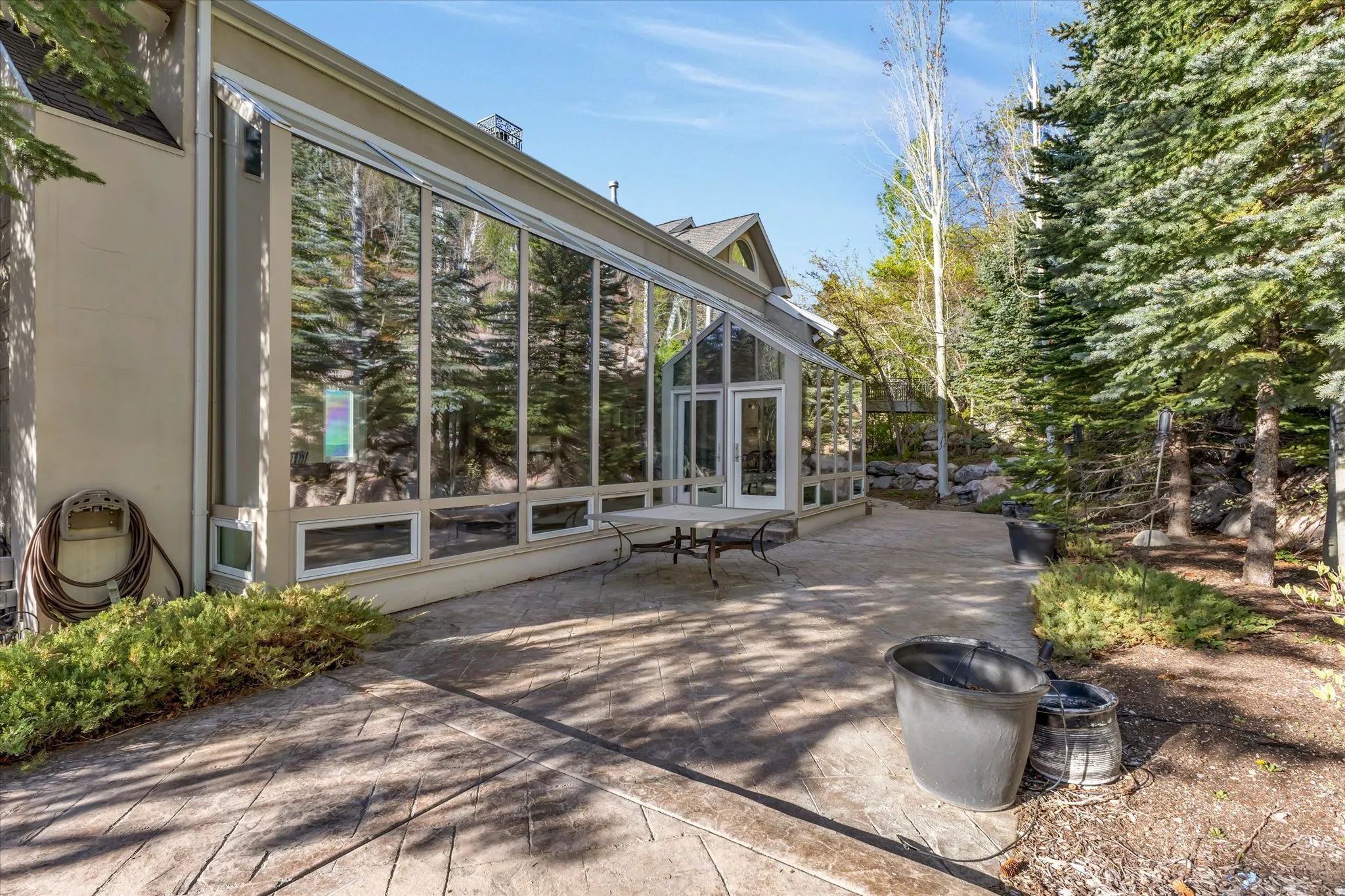 View of patio / terrace featuring a sunroom