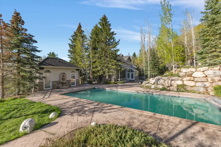 Outdoor pool featuring a patio