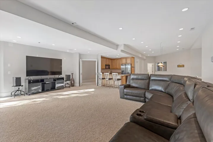 Living room featuring light carpet and recessed lighting