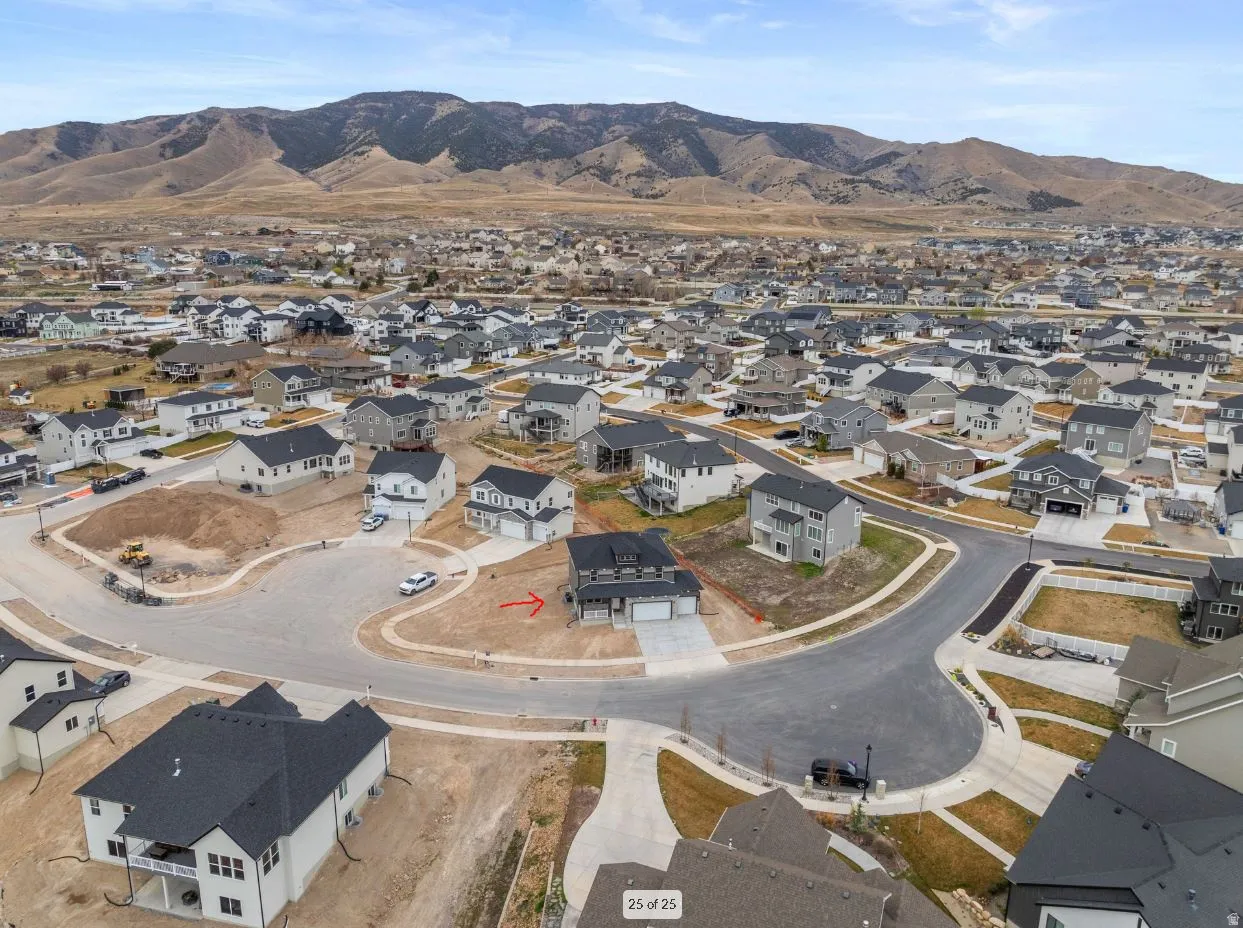 Aerial view of property's location with nearby suburban area